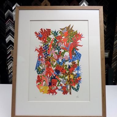 view of a colourful picture framed in white and brown combination