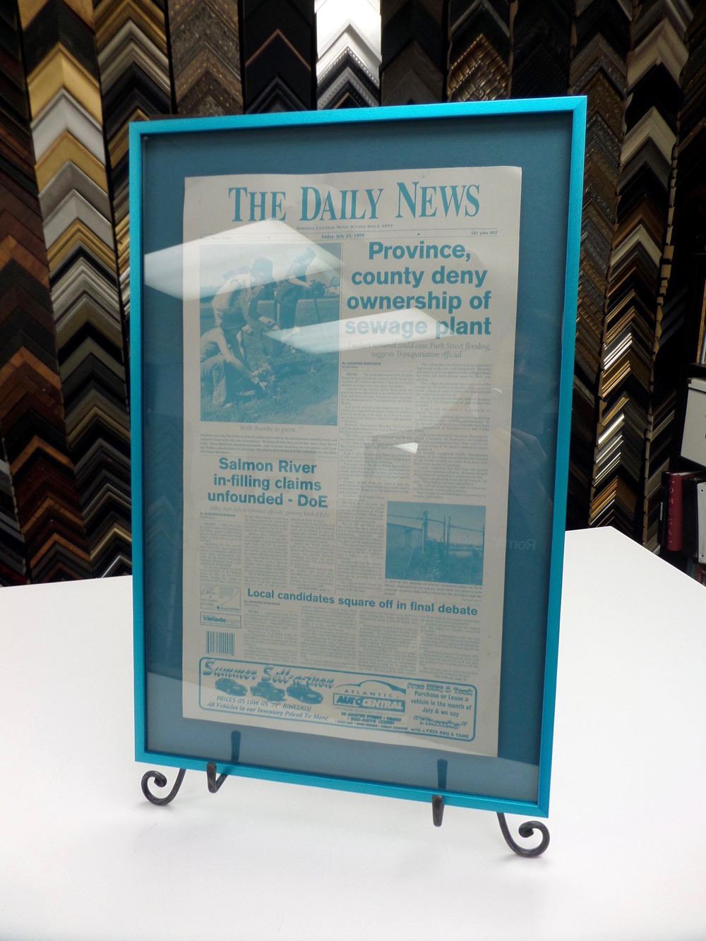 a newspaper page custom framed